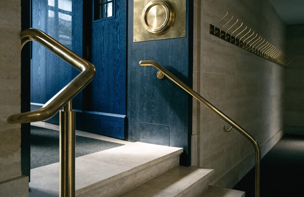 Quiet academy reception desk with a lamp and telephone in London
